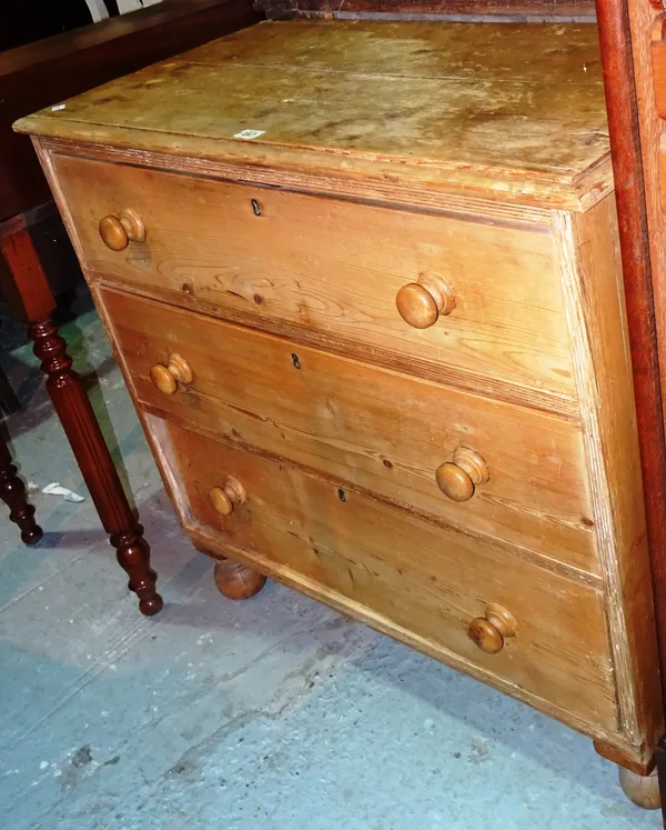 An early 20th century pine chest of three long drawers.  H9