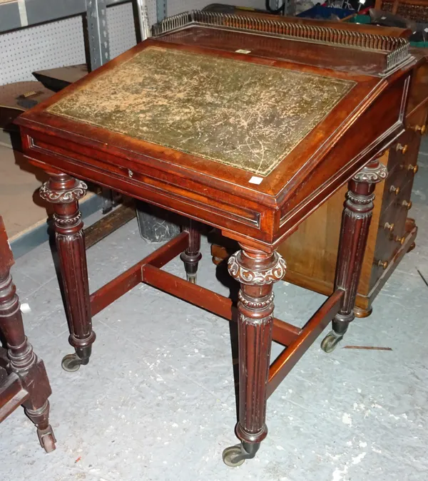 A Regency mahogany architect's writing table, with brass galleried top on fluted turned supports, 64cm wide x 88cm high.  L2