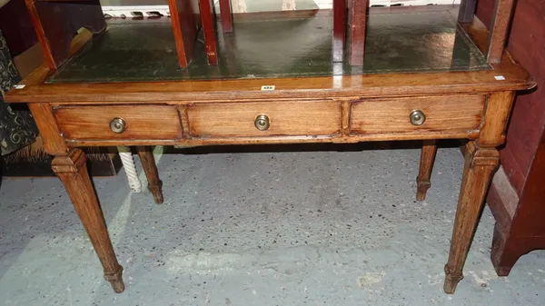 A late 19th century mahogany and oak writing table, with three frieze drawers, on square tapering supports, 124cm wide x 78cm high.  I5