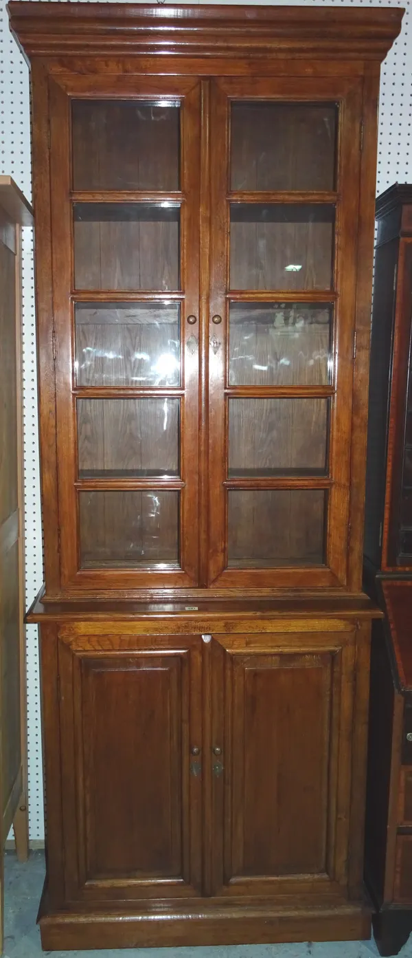 A 20th century hardwood bookcase cabinet, 90cm wide x 230cm high.  M5