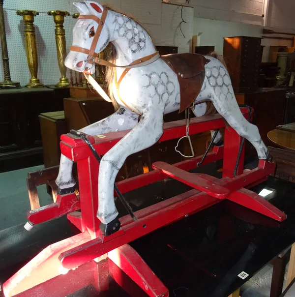 An early 20th century grey painted child's rocking horse.  D7