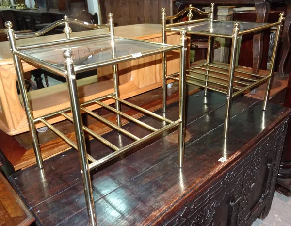A pair of 20th century brass and glass two tier bedside tables, 41cm wide x 57cm high.  I8