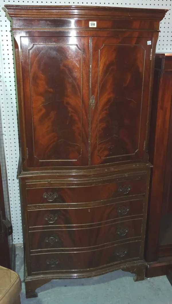 A 20th century mahogany serpentine chest on chest, 88cm wide x 156cm high.  H10