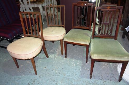 A pair of George III mahogany stick back dining chairs and a pair of Edwardian mahogany inlaid dining chairs with lyre splat back, (4). J7