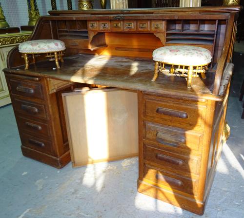 'Simpoles of Manchester', an early 20th century oak roll top pedestal desk, with fitted interior, 149c, wide x 104cm high.  C9