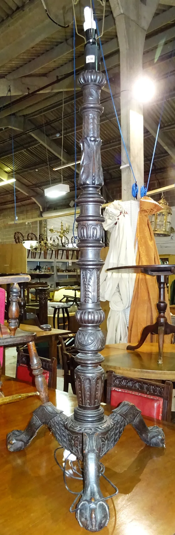 An early 20th century carved oak standard lamp, of Regency style, on ball and claw feet, 143cm high.  F6