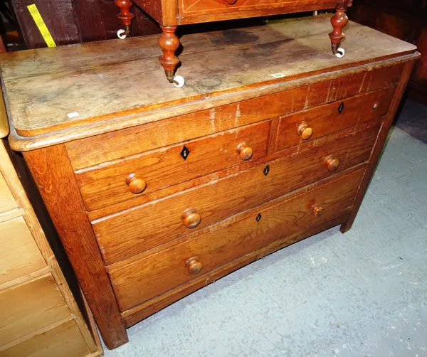 An early 20th century oak chest of two short and two long drawers, on square block supports, 121cm wide x 89cm high.  E9