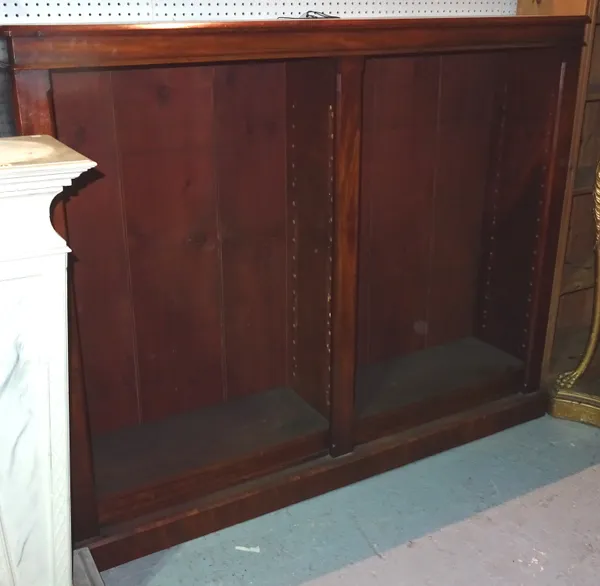 A Victorian mahogany floor standing twin section open bookcase, on plinth base, 166cm wide x 133cm high x 39cm deep.  I10