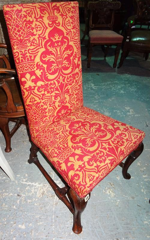 A Queen Anne walnut framed dining chair, on cabriole supports, united by four turned stretchers.  E7