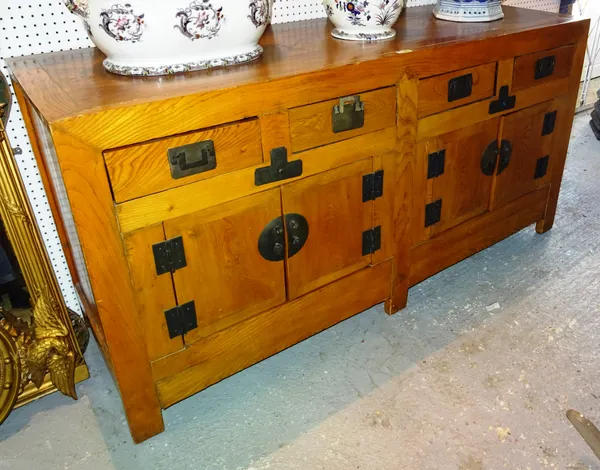A 20th century Chinese elm sideboard with four drawers over two door cupboard base, 189cm wide x 95cm high.  A5