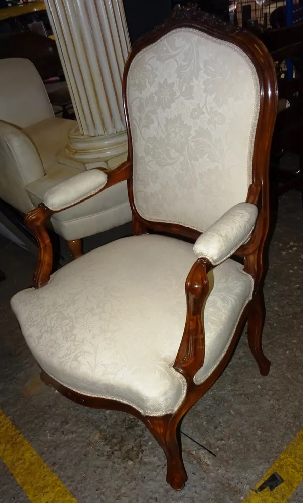A Louis XV style walnut framed open armchair, on scroll supports, 62cm wide x 100cm high. EXTRA