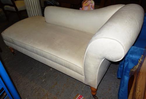 A 20th century scroll end chaise longue, on turned supports, 178cm wide.  EXTRA