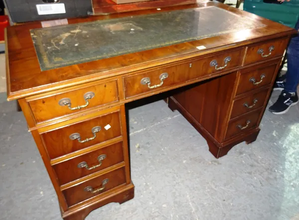 A 20th century yew pedestal desk with green leather inset top, 122cm wide x 76cm high.  K2