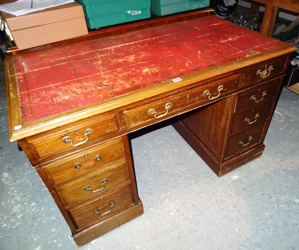 A 20th century mahogany pedestal desk with red leather inset top, 119cm wide x 74cm high.   J2