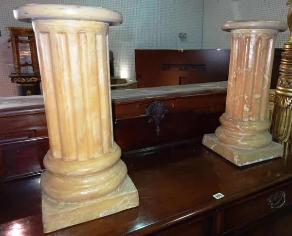 A pair of 20th century faux marble low jardiniere stands with fluted column on plinth base,  53cm high, (2).  C9