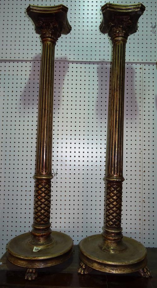 A pair Regency style gold painted jardiniere stands, with fluted column on plinth base, on claw feet, 25cm wide x 120cm high, (2).   D10