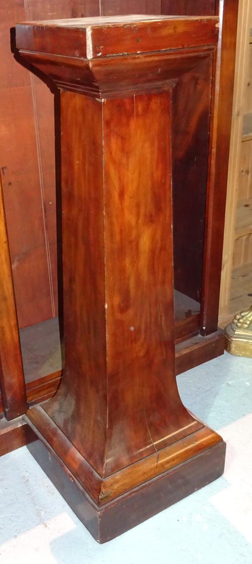 A late Victorian mahogany jardiniere stand, with square top on a square spayed central column, 30cm wide x 121cm high. H9