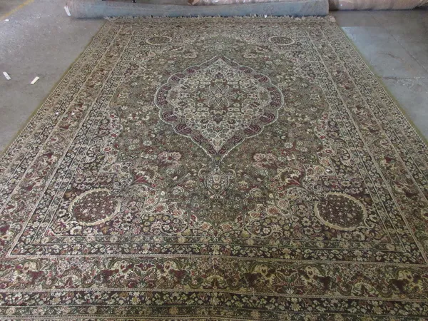 A machine made carpet of Persian design, 363cm x 275cm.  D5