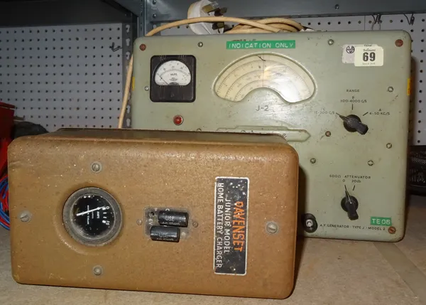 An early 20th century Advance J-2 signal valve generator, and a Davenset vintage battery charger, (2). S4