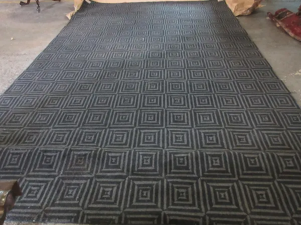 A modern machine made carpet, with stylised Greek key pattern.