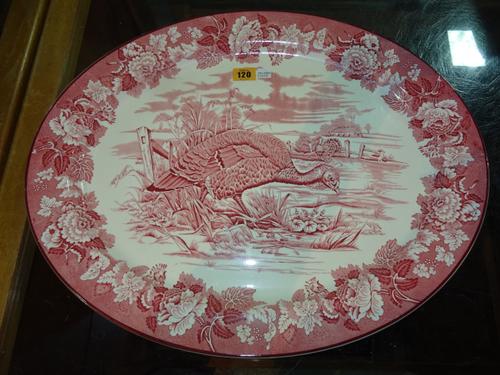 A large early 20th century oval Woods Burslem transfer printed serving dish, decorated with game birds.  CAB