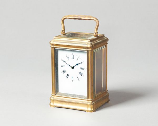 A French brass carriage timepieceCirca 1890In a gorge case, with white enamel dial, the movement No. 22677, with original platform lever escapement an