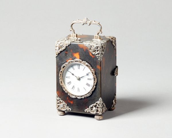 An Edwardian silver-mounted tortoiseshell carriage clockLondon 1893The rectangular case with silver repouseé mounts, the twin train movement with push