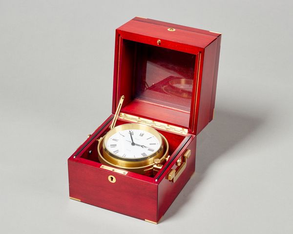 A Modern Swiss brass-mounted mahogany cased quartz Marine ChronometerRetailed by AspreyThe case of usual form, the movement with white painted dial, i