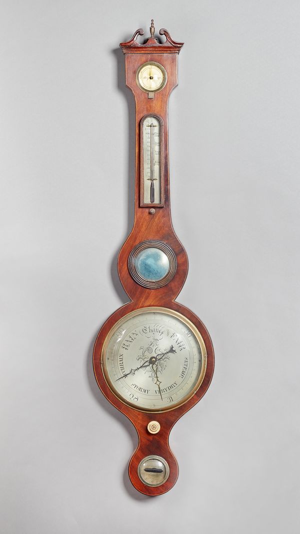 A mahogany and outlined wheel barometerRetailed by J. Pastorelli, 55 Cable Street, LiverpoolThe trunk inset hydrometer, thermometer and convex mirror