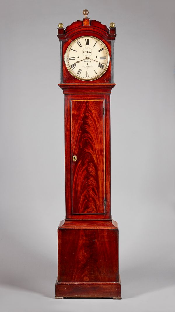 A William IV mahogany three-train quarter striking longcase clockBy Pryor, LondonThe case with an arched pediment surmounted by three spherical brass