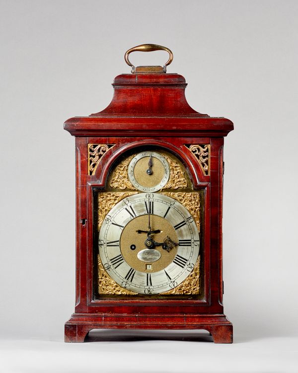 A George III mahogany bracket clock By William Fleetwood, LondonWith an ogee pediment, surmounted by a brass carrying handle, above glazed sides and d