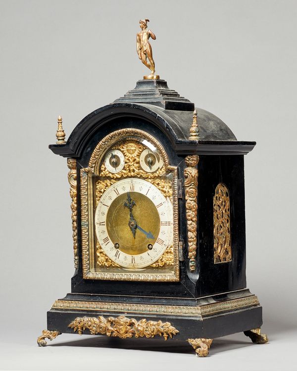 A Late Victorian ebonised and giltmetal mounted ting-tang mantel clockBy Winterhalder & HofmeierThe broken arched case surmounted by a gilt bronze fig