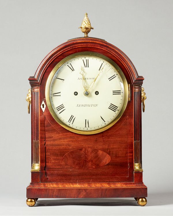A George III mahogany and boxwood line inlaid bracket clockInscribed Anderson, NewingtonThe broken arched case surmounted by a pineapple finial, above