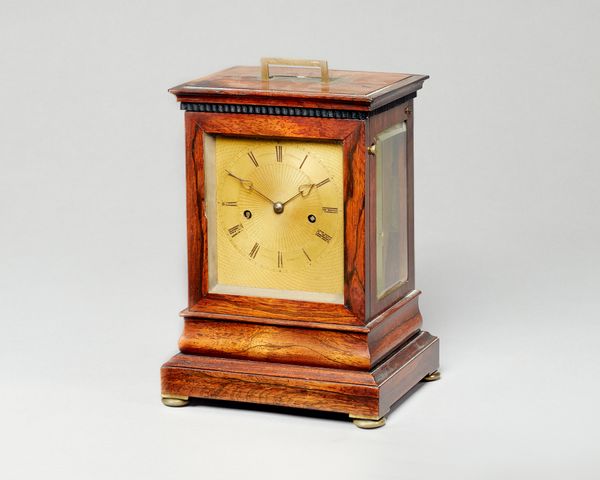 A William IV  rosewood mantel clockBy Dwerrihouse & Ogston, Davies Street, LondonThe case with a rectangular top, inset with a recessed carrying handl