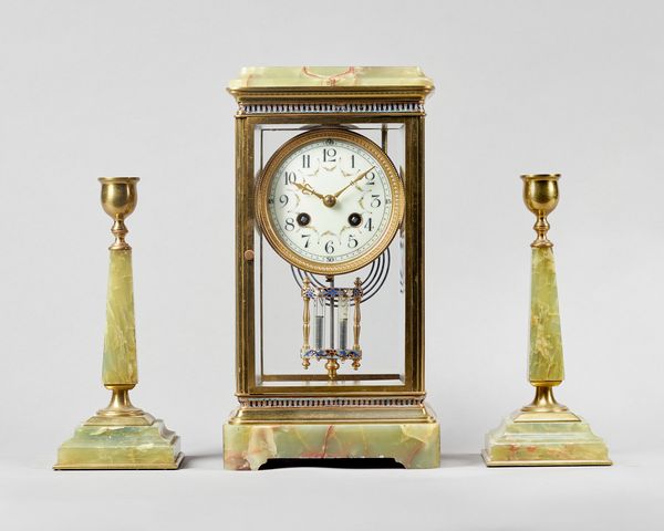 A French giltbrass, enamel and green onyx four glass mantel clock garniturecirca 1910The clock, with a stepped pediment above a glazed front and back