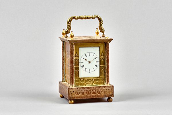 An unusual early Victorian giltmetal carriage timepieceRetailed by Ross, ExeterThe case decorated with Gothic tracery, surmounted by a shaped handle a