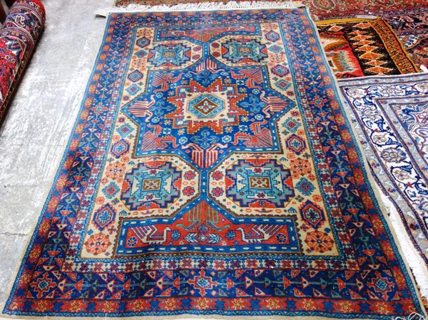 An Indian rug of Caucasian indigo and cream design, 201cm x 128cm.  E4