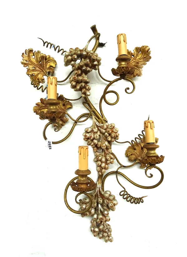 A pair of modern wrought iron and giltwood carved four branch wall appliques, cast with naturalistic fruiting grape vines, 75cm high, (2).