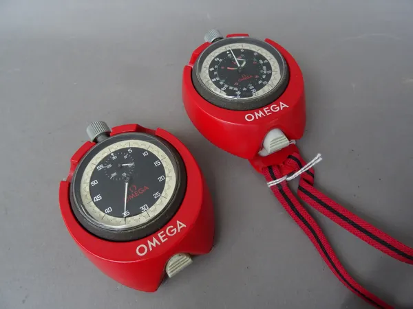 An Omega 9010A yacht timing stop watch, with plastic case and cord neck strap, and an Omega 9300A stop watch, in a red plastic case, (2).