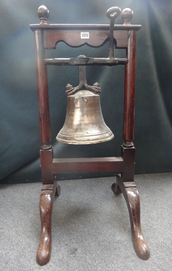 A bronze bell, late 19th century, mounted in a floor standing mahogany frame with cast iron mounts and handle, 88cm high.