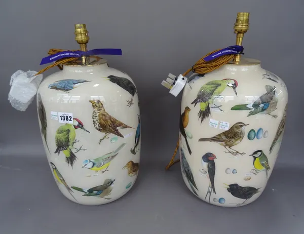 A pair of modern Decalcomania glass table lamps, decorated with wild birds, 35cm high, (2)