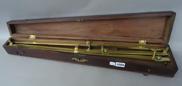 A Dollond brass pantograph, 19th century, on four turned castors in a fitted mahogany case, 61.5cm.
