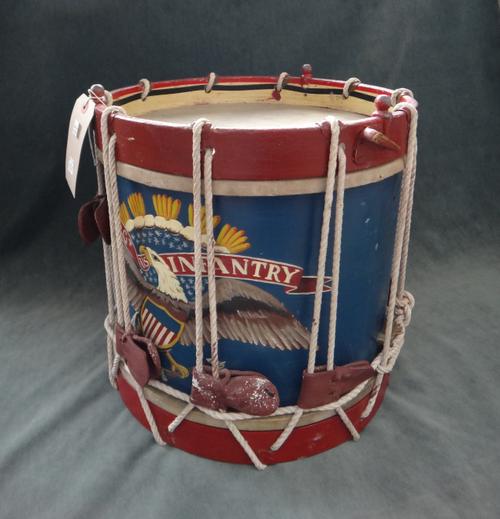 A wooden and rope bound bandsman's parade bass drum, painted red, white and blue (70cm diameter) and one small wooden and rope bound parade drum, deta