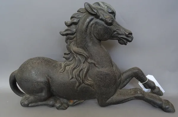A half block cast iron horse, late 19th century, modelled resting on its hind legs, 64cm wide.