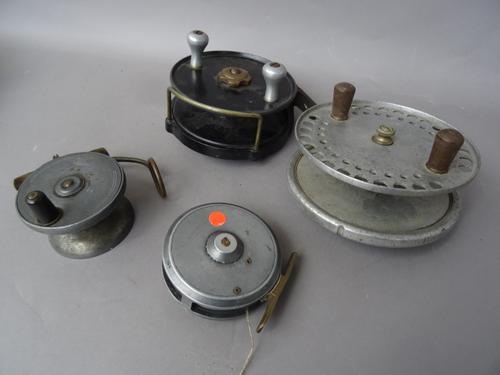 A Hardy 'Longstone' 6 inch sea fishing reel, an Ogden Smiths 'Seaos' 5 inch sea fishing reel, a Mullochs patent 3 inch reel and an A.W.Gamage Ltd 3.5
