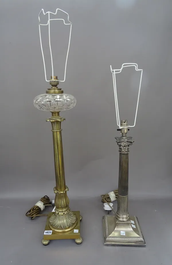 A Victorian brass table lamp (formerly an oil lamp), with foliate cast column and cut clear glass reservoir, on a square base and four feet, 62cm high