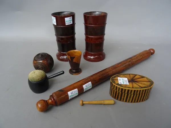 A group of small treen collectables, comprising; a parquetry inlaid oval trinket box, 7cm wide, a circular pen case, a novelty 'saucepan' pin cushion,