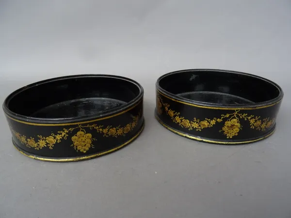 A pair of Regency papier mâché wine coasters, with gilt swag decoration, 13cm diameter, a French gilt bronze and mother-of-pearl stand, late 19th cent