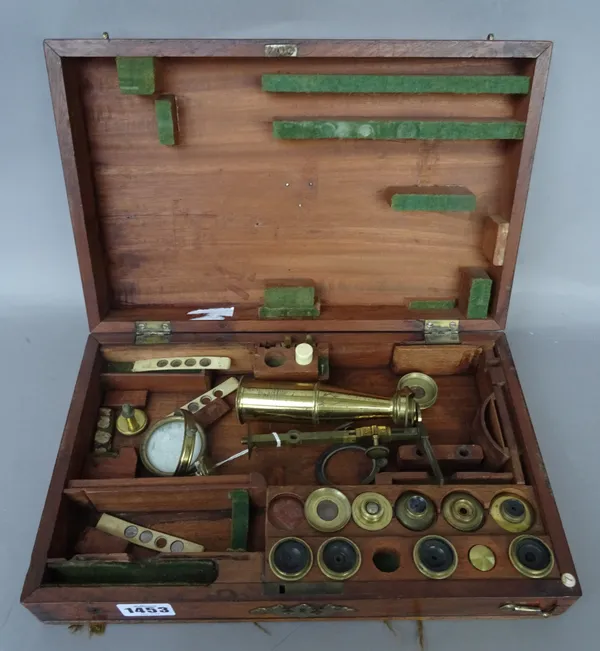 A Martin type brass drum microscope, English, C.1840, with rack and pinion focusing, six objectives and various bone slides in a fitted mahogany case,