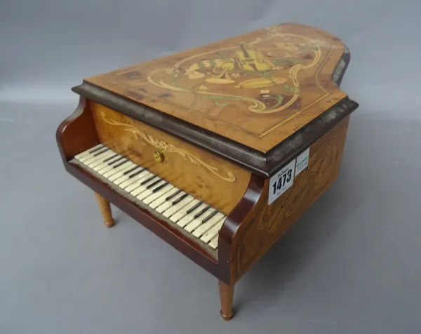A Franklin Mint 'House of Faberge' novelty cylinder music box, modern, in the form of a miniature grand piano, containing five 2.5inch brass cylinders